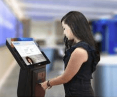 Woman at Airport Kiosk